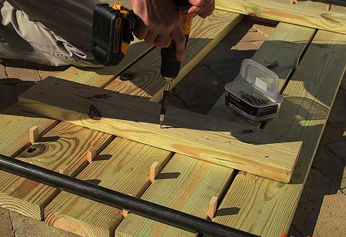 CLAMP THE TABLE SLATS TOGETHER via THE HOME DEPOT