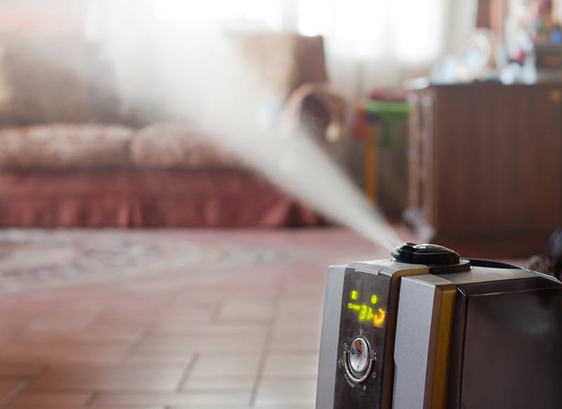 Digital humidifier with ionic air purifier at home interior