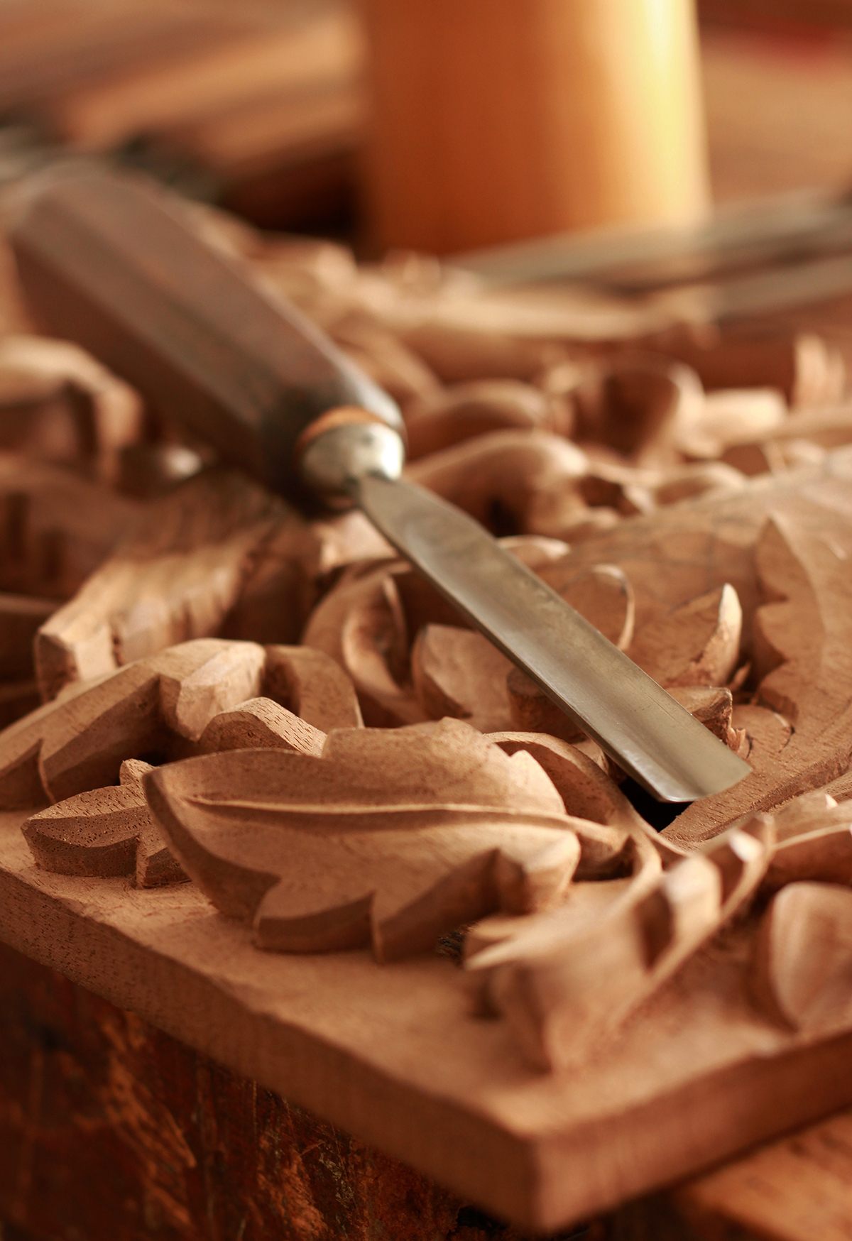 Wood sculpture with chisel