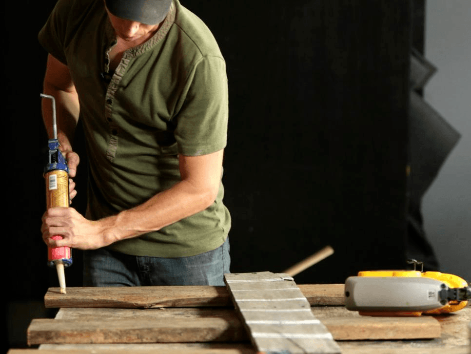 how to make an upcycled headboard from a wood pallet pictures via DIY Network